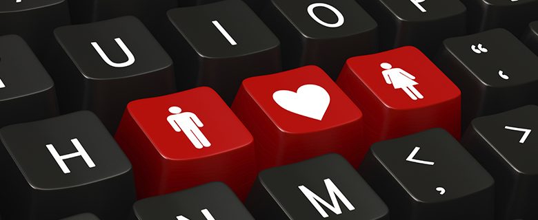 Disability dating sites, image of a keyboard with red male and female symbols and a love heart between them