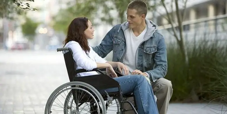 disabled person talking to a stranger