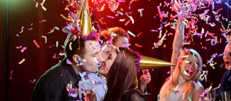 New Year's Eve couple kissing