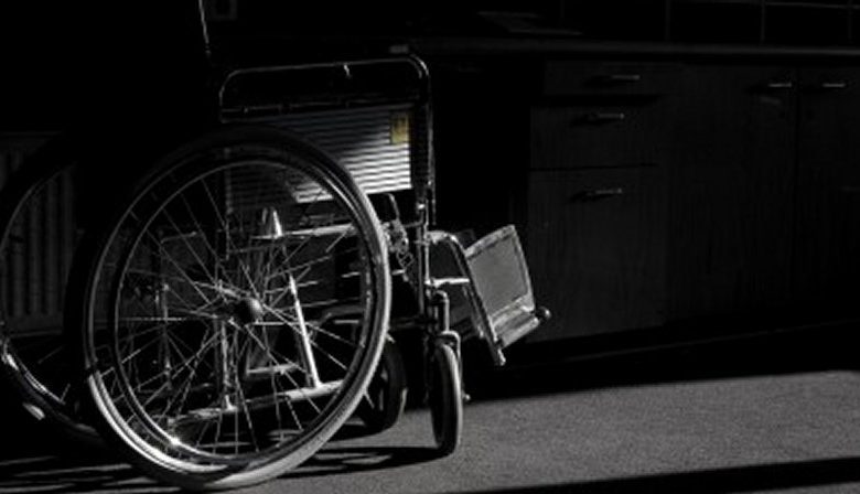 wheelchair in darkness