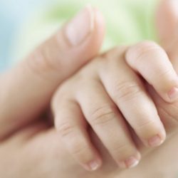 Mum holding a baby hand