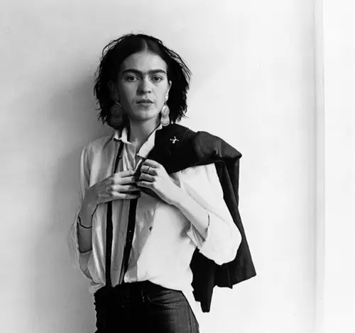 Frida Kahlo in white shirt, black trousers and braces