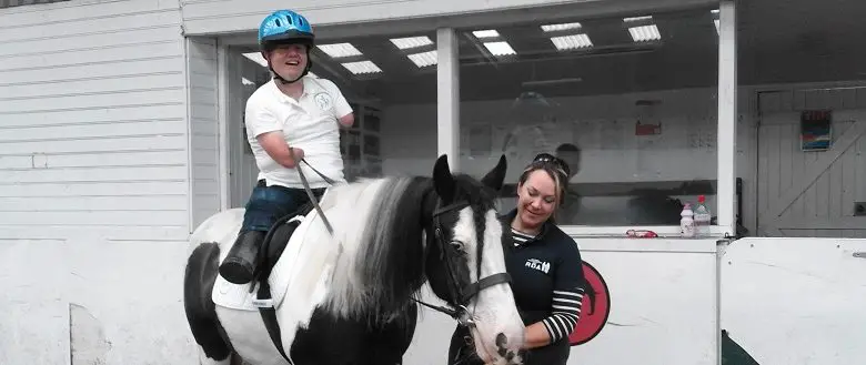 Disabled man John Willis riding a horse