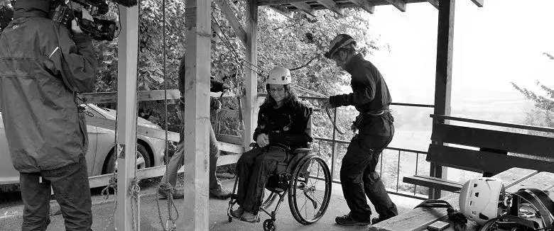 Carrie Ann abseiling in a wheelchair