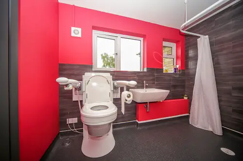 Adapted bathroom from Closomat with red wall