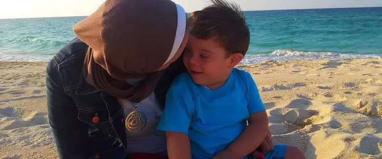 Tasneem as with his mother on a beach