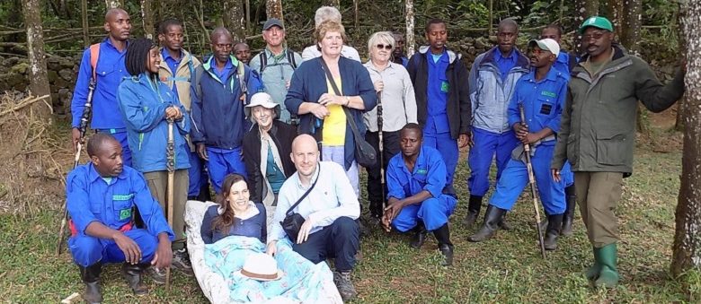 Susie in stretcher with group visiting gorillas