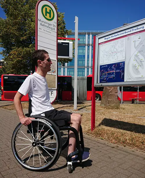 Dominic Lund-Conlon visiting a wheelchair factory