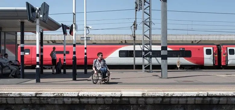 David Proud on platform at train station