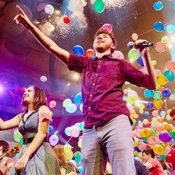 Music for Youth performing with lots of balloons on stage