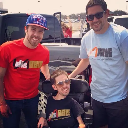 Jimmy, Eddie and Mike wearing DisABLE t-shirts