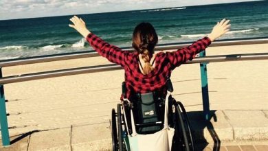 Shannon Kelly in wheelchair at beach