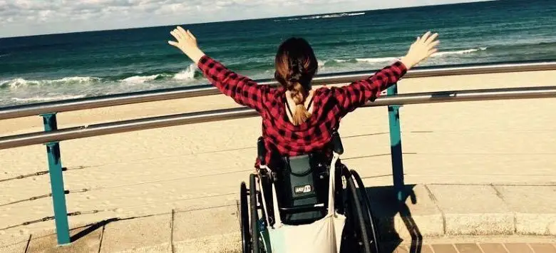 Shannon Kelly in wheelchair at beach