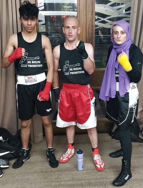 Disabled boxer Sannah Hussain with two male boxers