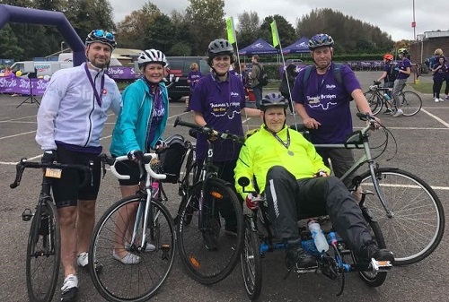 Nick completing cycling challenge in adapted bike