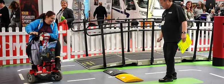 Disabled woman on mobility test track at Naidex 2019