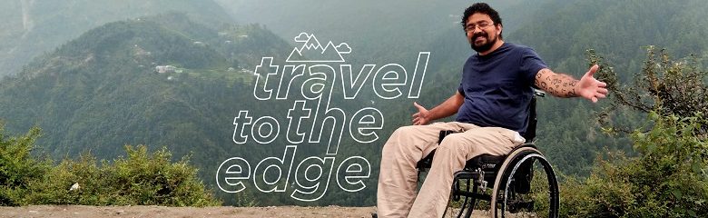 Wheelchair user on the top of a mountain in India