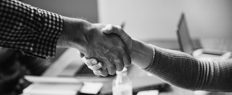 Two people shaking hands