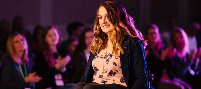 Wheelchair user Shannon modelling in a fashion show for wheelchair users