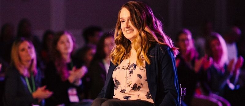 Wheelchair user Shannon modelling in a fashion show for wheelchair users