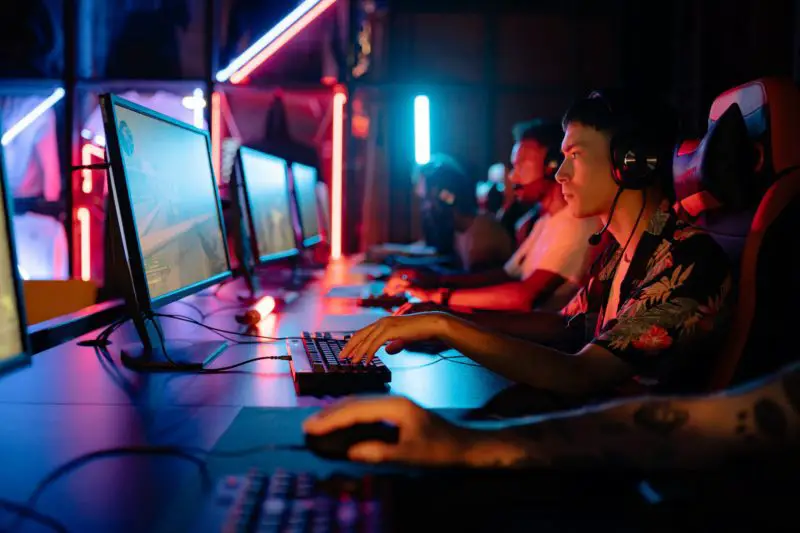 Men enjoying gaming on computers