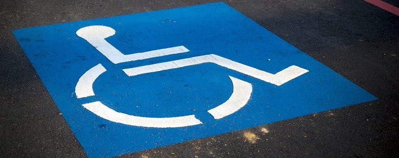 Wheelchair symbol on disabled parking space