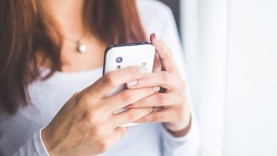 Woman using a disabled dating app on a mobile phone