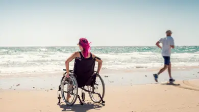 woman in a wheelchair on the beach