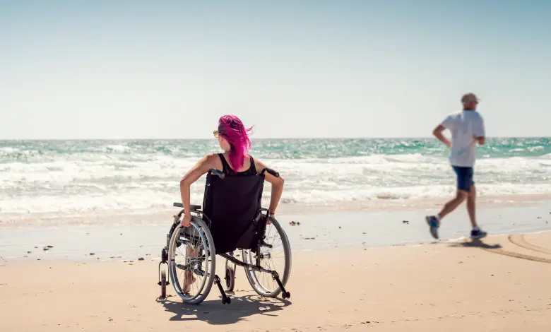 woman in a wheelchair on the beach