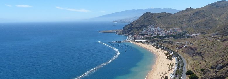 View from above of Tenerife beach with mountains in the background