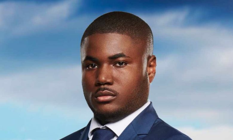 Souleyman Bah on The Apprentice. Souleyman Bah, a Black man with short hair, smiling confidently in a business suit