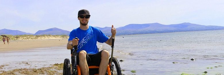 Mountain Trike all-terrain wheelchair on a beach