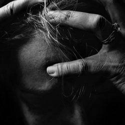 Woman with hands on hair frustrated