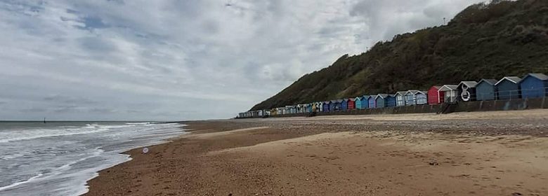 A beach in Norfolk with beach huts