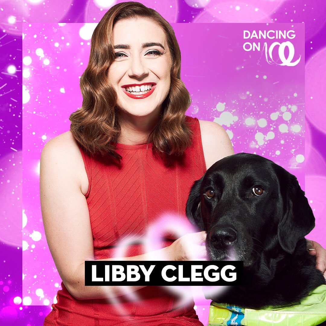 Libby Clegg on Dancing on Ice. Libby has long brown hair, wearing a red dress and with her black labrador guide dog