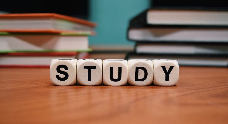 Word study on a wooden table spelt in scrabble letters