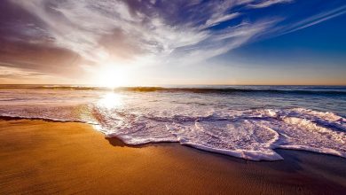 Beach at dusk with waves crashing
