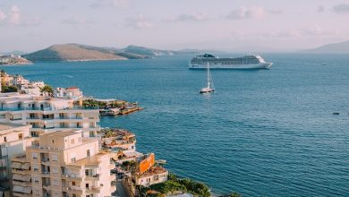 Cruise ship on a sea off the coast of a seaside town abroad