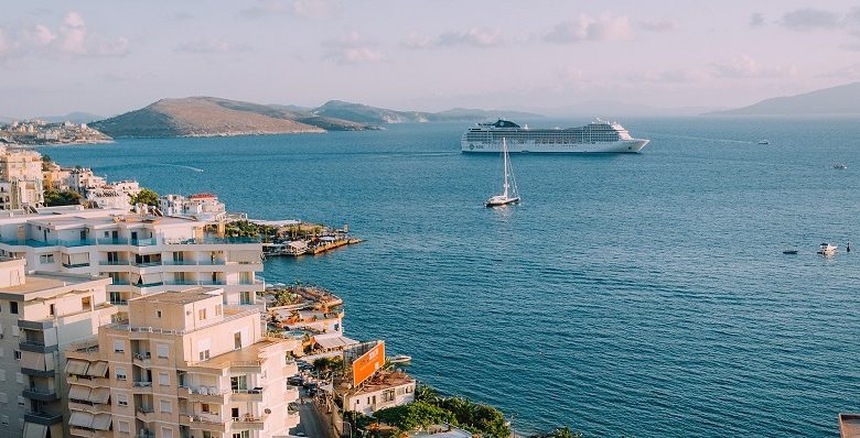 Cruise ship on a sea off the coast of a seaside town abroad