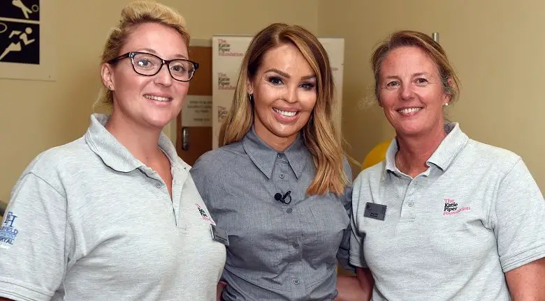 Katie Piper at her Burns Rehabilitaion Centre with two physiotherapists