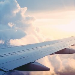 Plane wing amongst clouds