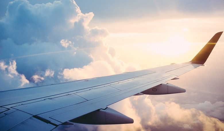 Plane wing amongst clouds