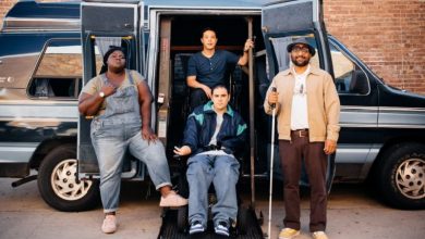 Sam, Mo, Scotty and Matt posing in front of the van