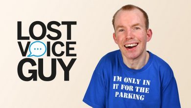 Lee Ridley next to his Lost Voice Guy logo
