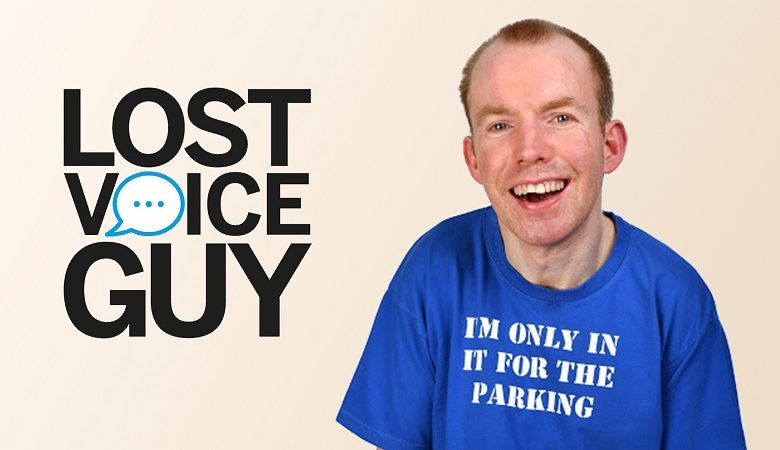 Lee Ridley next to his Lost Voice Guy logo