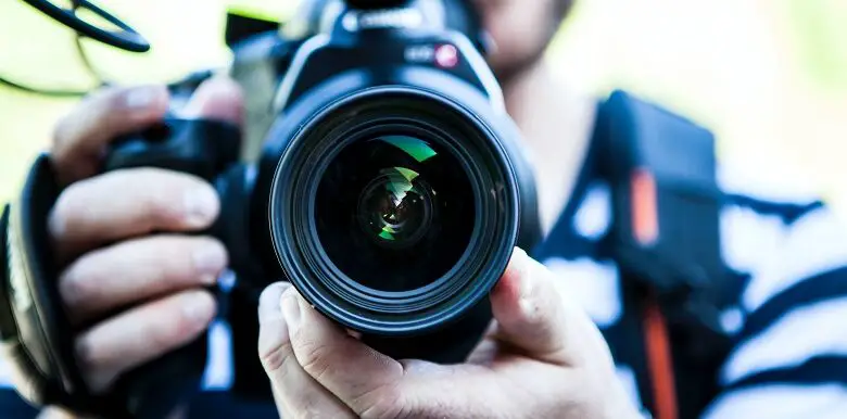 Close up of a camera being pointed at the camera