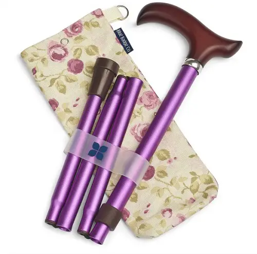 Stylish purple folding walking stick and floral bag with pink flowers on a cream background