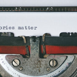 A typewriter has written Stories Matter - photo by Suzy Hazelwood