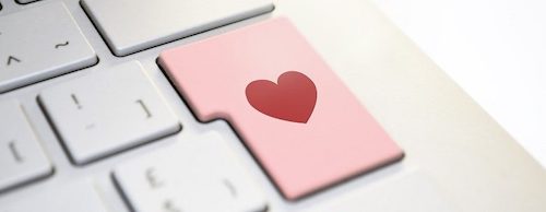 Disabled dating computer keyboard with heart on enter button