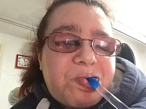 Emma Purcell with Hydrant water bottle bite valve and tube in her mouth
